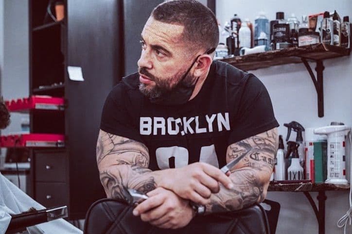 Casper with clippers, barber and owner of Cutz By Casper.
