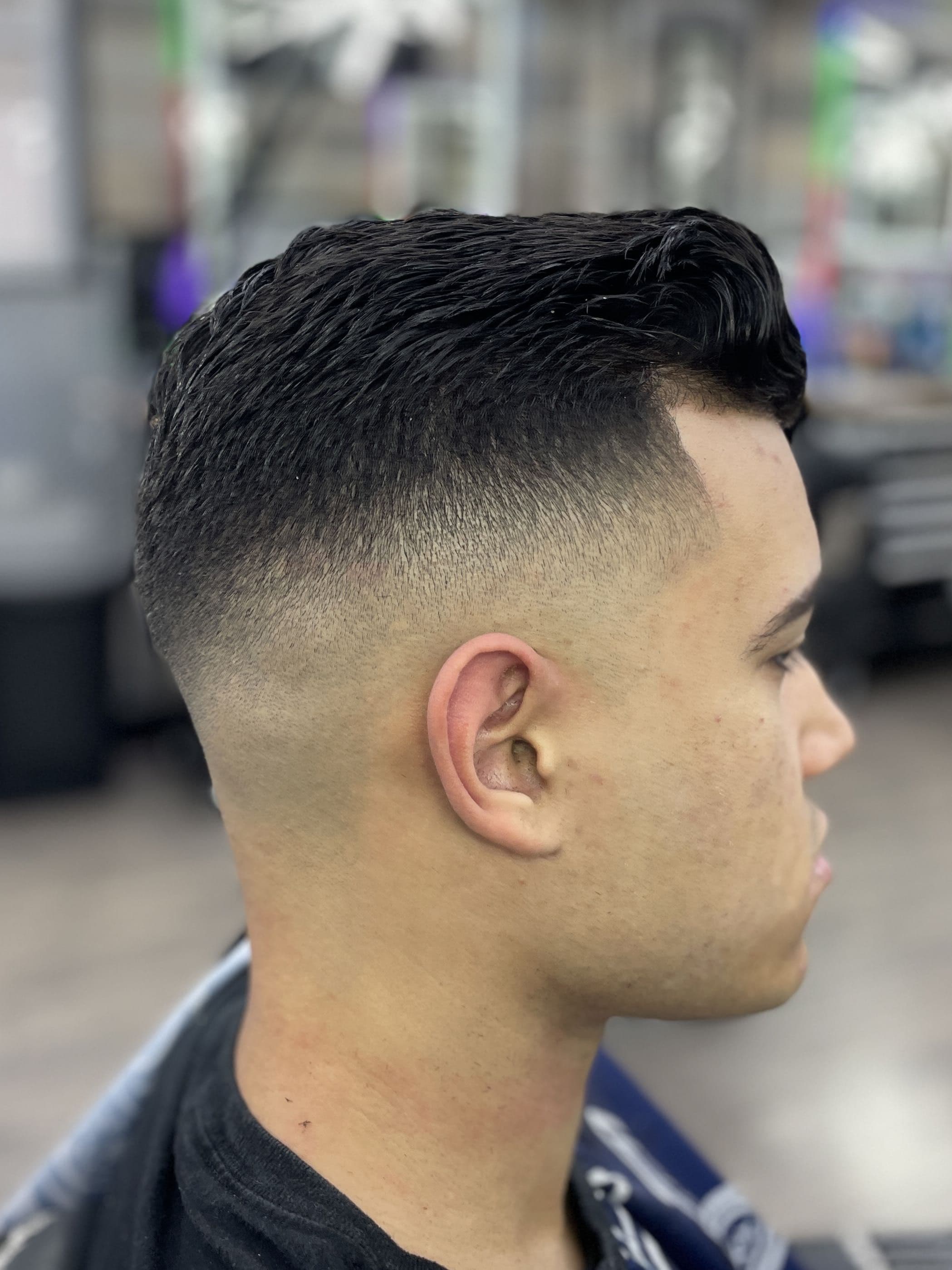 Classic taper with a low fade and textured top.